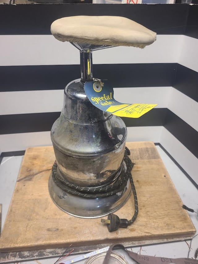 r/whatisthisthing - Found this recently in an abandoned farm house. It's about 15in tall and is made of a steel chrome finish. The base heats up when plugged in. The top has a cloth cover and is pear shaped. WITT